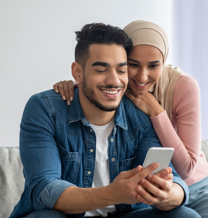 Couple looking at mobile phone
